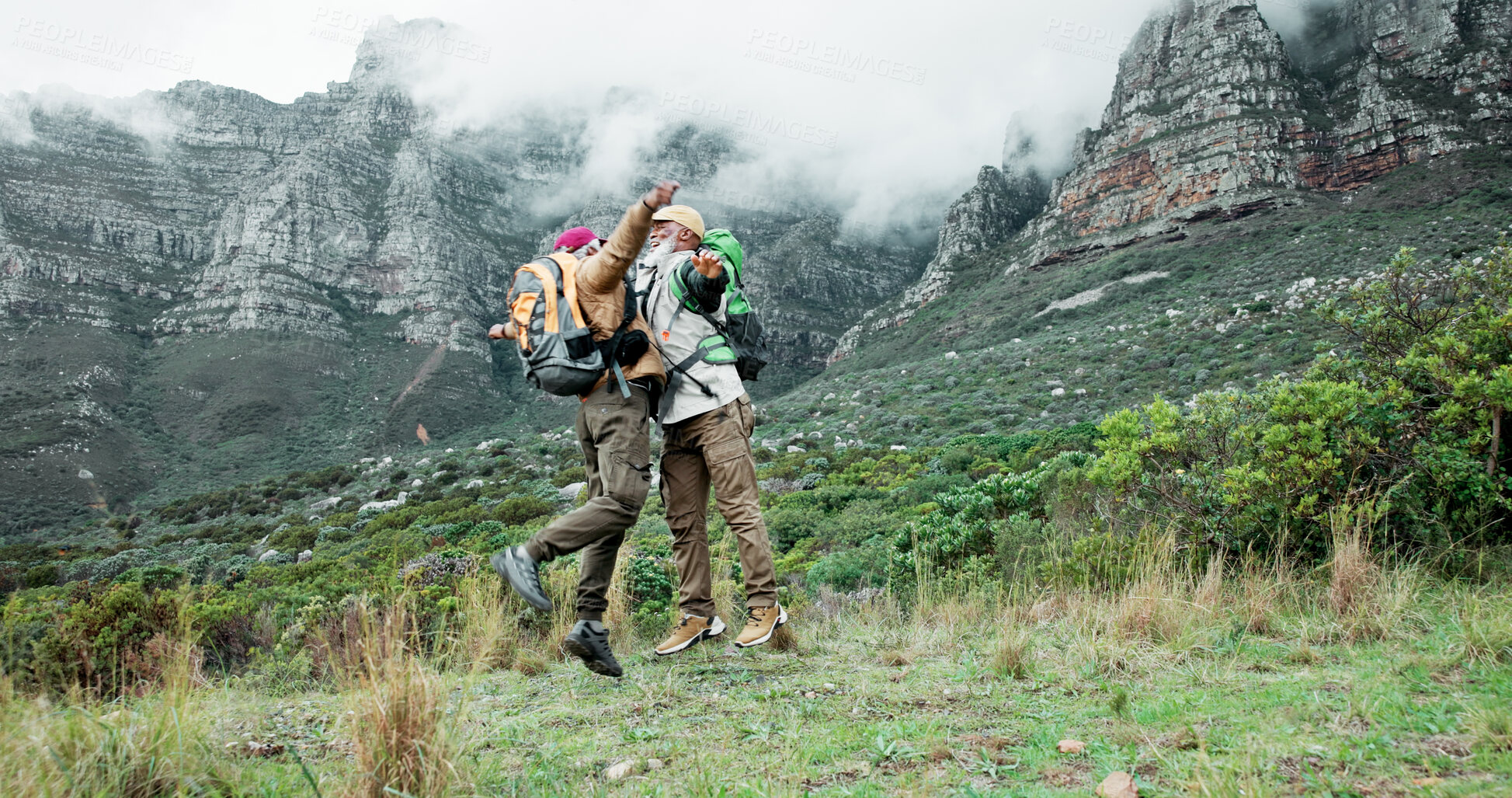 Buy stock photo Victory, hug or friends hiking on mountain in outdoor adventure celebration in nature travel. Success, winning or excited black people jump on trail for chest bump, achievement or trekking to explore