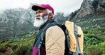 Senior, mountain or black man hiking in outdoor adventure or journey in woods or nature travel. View, thinking and Arfican person on trail walking for holiday, break or trekking to explore in France