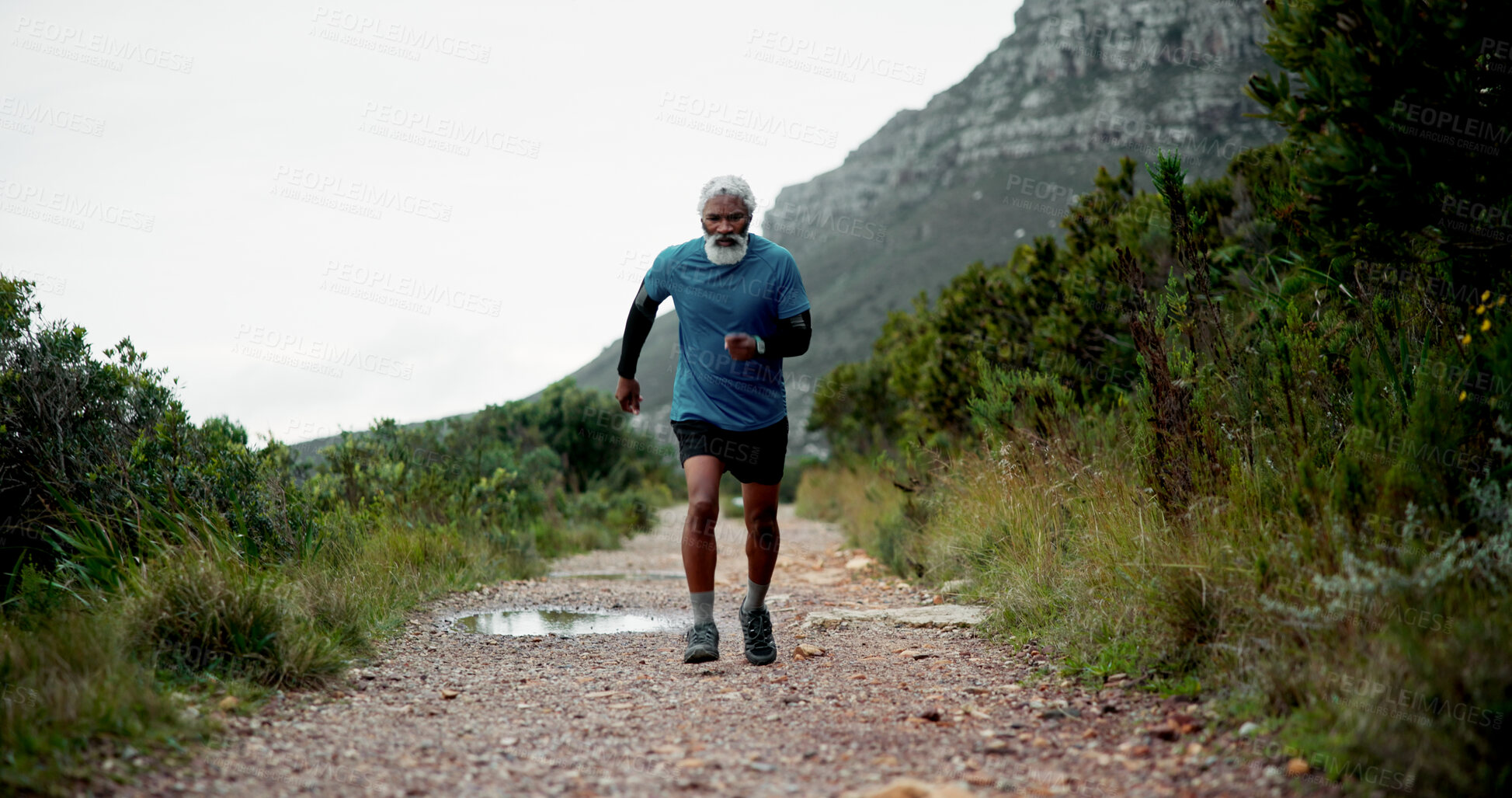 Buy stock photo Running, senior or black man on path for fitness, health and wellness in retirement to exercise.  Body mobility, runner and male person on trail in nature for workout, cardio performance and training