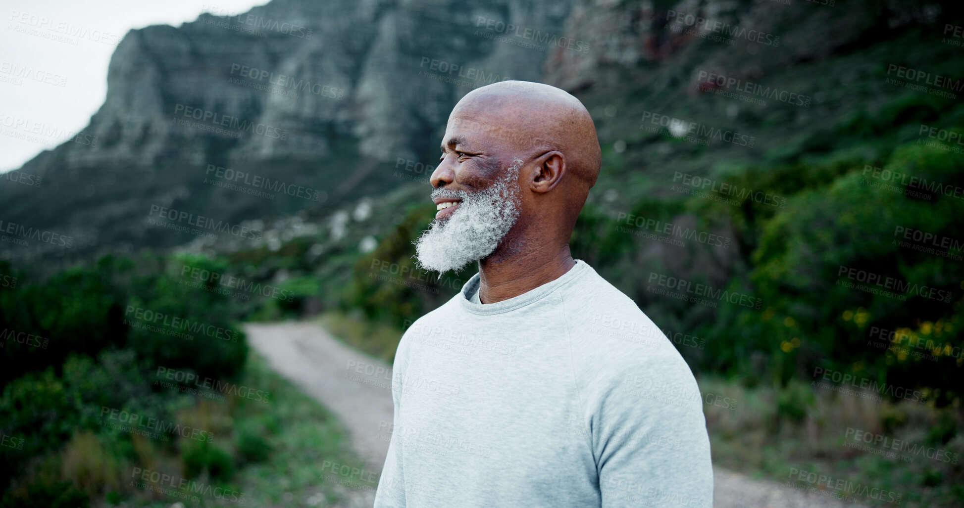 Buy stock photo Black man, mature and smile in nature for fitness, peace and healthy body accomplishment. Senior person, happy and rest on mountain for hiking, wellness and scenic view from pathway or walking trail