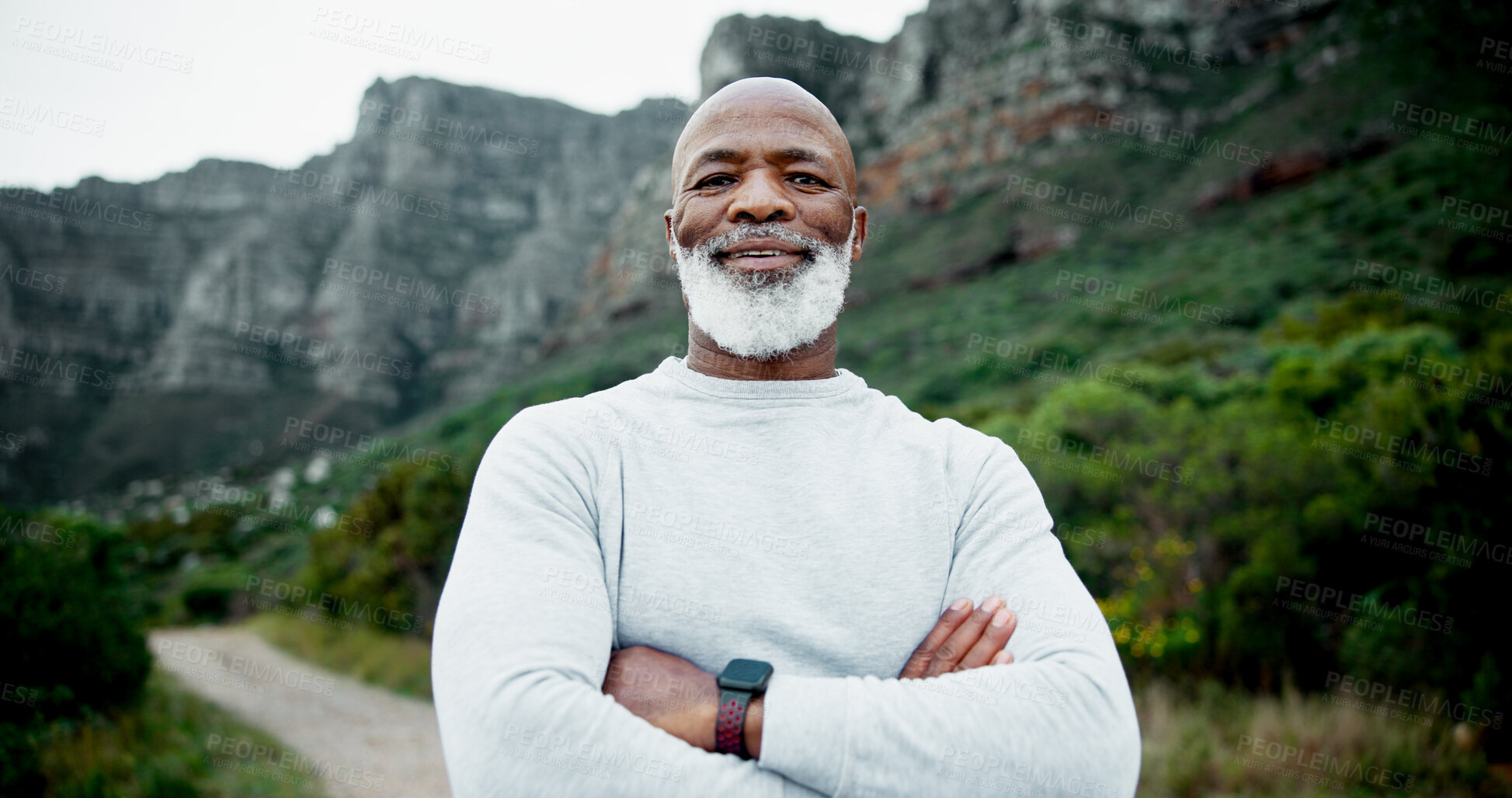 Buy stock photo Portrait, senior runner or black man in nature for fitness, health and confidence in retirement to exercise. Body mobility, proud or arms crossed by mountain for workout, performance and training