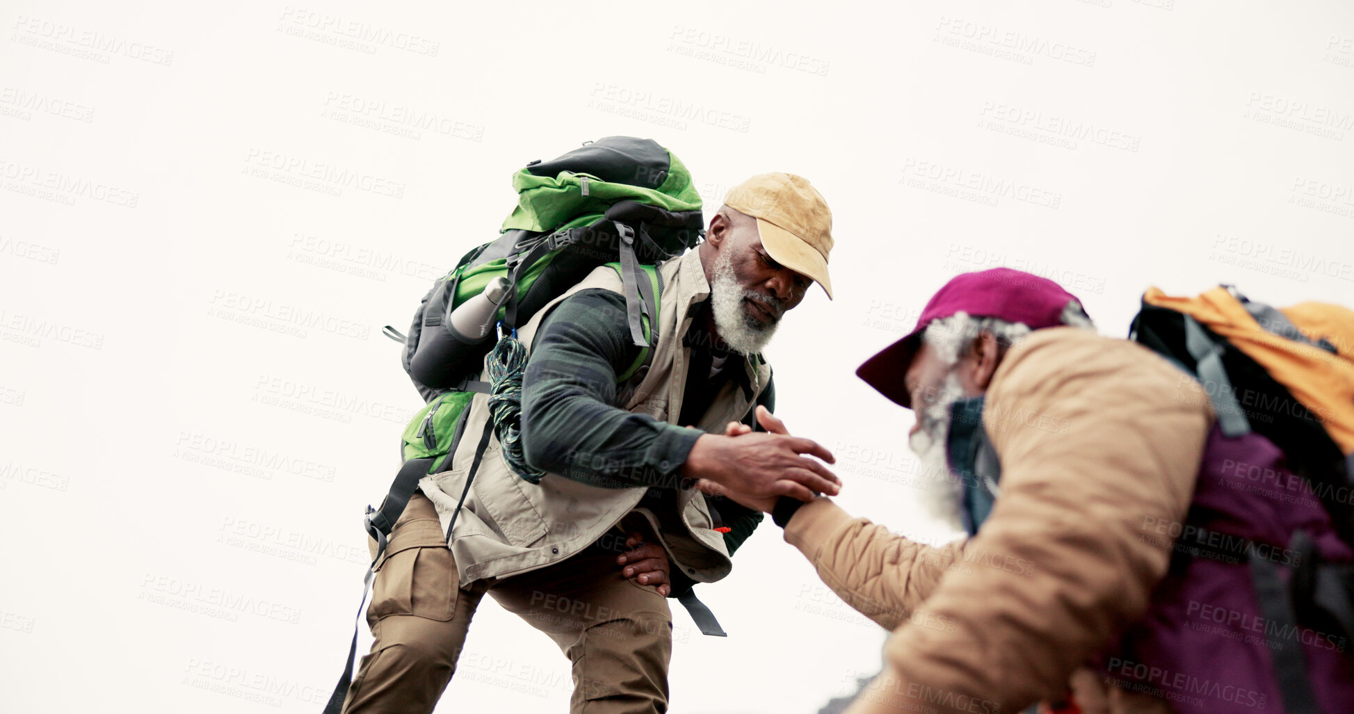 Buy stock photo Fitness, hiking and senior men with helping hand for support, physical activity or climbing mountain. Low angle, mockup and elderly person with friend for cardio workout, exercise or trekking in Cuba