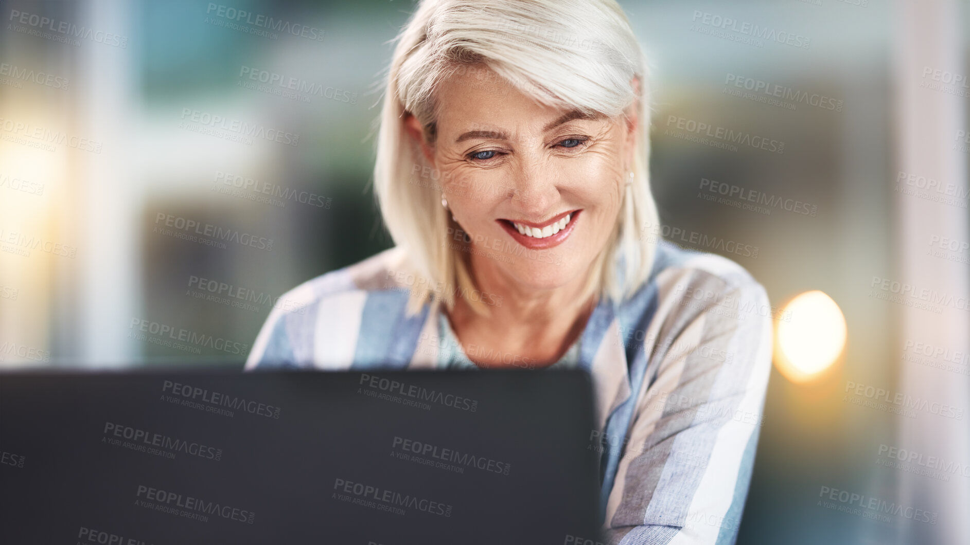 Buy stock photo Smile, reading and mature woman in night, office and happy with feedback of project, deadline or journalist. Laptop, employee and editor for article in newsroom, online or overtime of typing of story