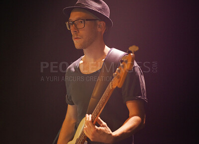 Buy stock photo Music festival, man and playing guitar for entertainment, night and artist with musical instrument. Male person, performer and equipment at concert, confident and rock star  at show on black backdrop