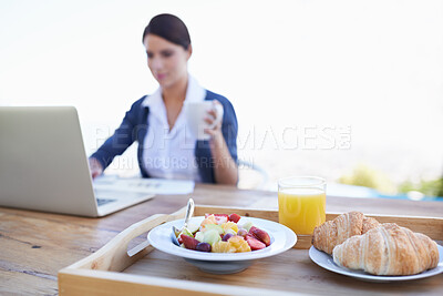 Buy stock photo Food, laptop and breakfast outdoor, woman and table with healthy meal, freelancer and online. Person, worker and writing  with technology, pc and creative with coffee in remote work and business

