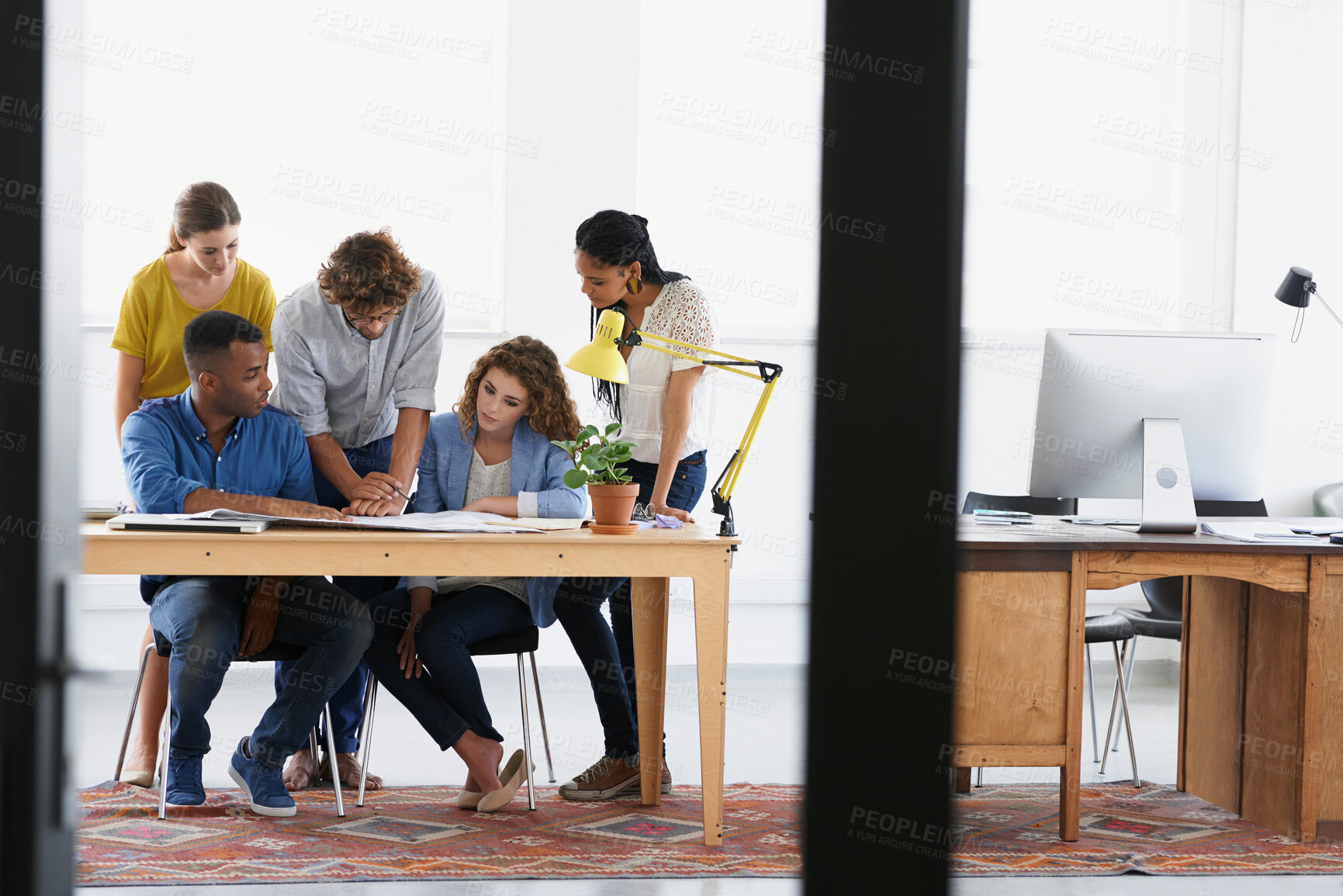 Buy stock photo Diversity, business people and documents in team collaboration for project planning or strategy at the office. Group of employees in meeting working on paperwork together for plan at the workplace