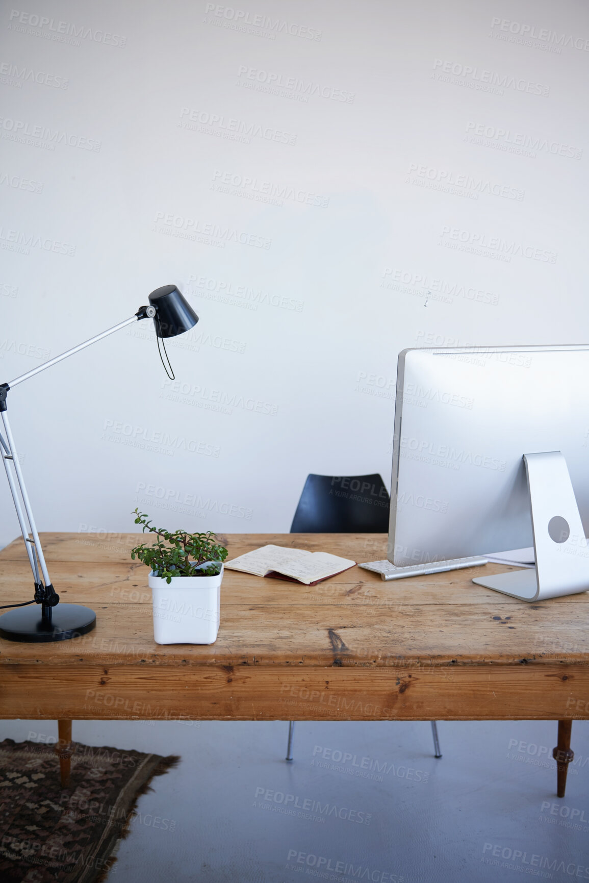 Buy stock photo Empty office, computer desk and small business startup of interior or online marketing studio. Photo wall with desktop PC and notebook with lamp on table for creativity in a clean modern workspace