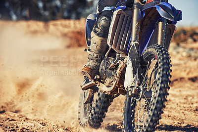 Buy stock photo Closeup, dirt track and wheels of motorcyclist with motorbike for race, extreme sports or outdoor competition. Legs of expert rider on bike, scrambler or sand course for off road rally challenge