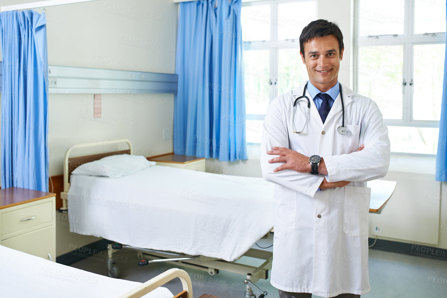 Buy stock photo Portrait, doctor and man with smile, arms crossed and happy for first day in hospital, proud and expert. Clinic, medical professional and confidence of person, healthcare and lab coat for employee