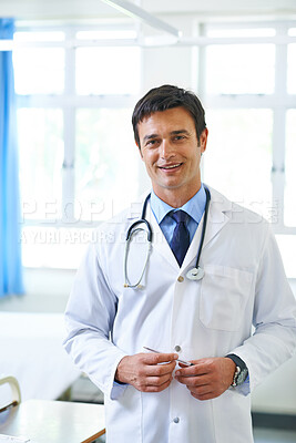 Buy stock photo Portrait, doctor and man with smile, medical and happy for working in hospital, proud and expert. Clinic, professional and confidence of person, healthcare and orthopedic for employee for service