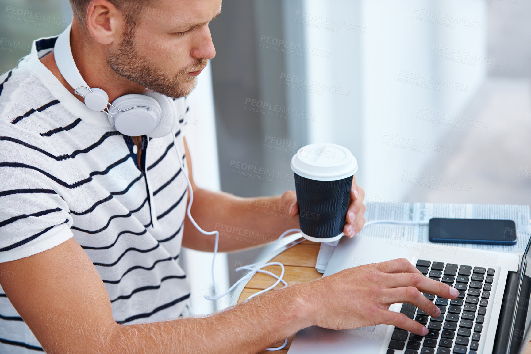 Buy stock photo Laptop, typing and man with headphones, coffee and freelancer with website, online or video editing. Outdoor, digital and working in morning, creative and person with keyboard for remote work in home