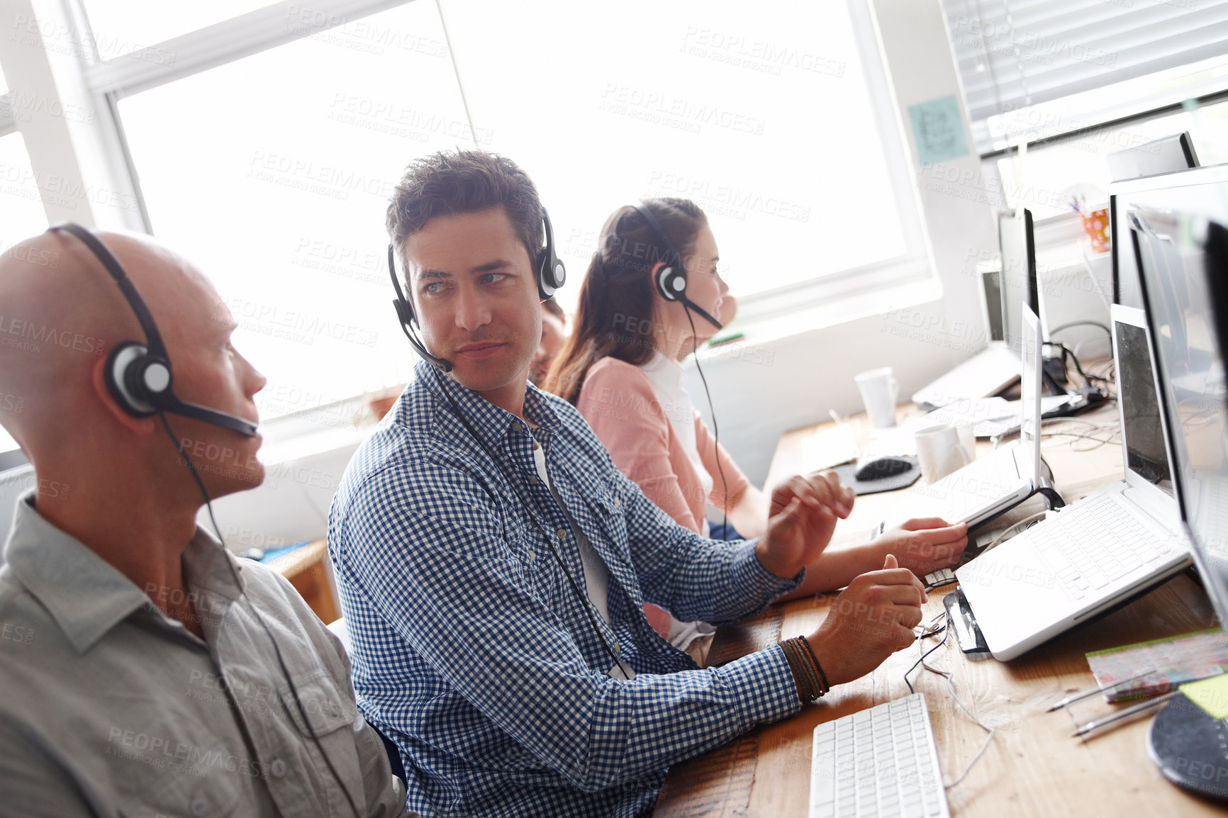 Buy stock photo Business people, call center and agency with team in telemarketing, customer service or support at office. Group of employees, agents or consultants working on computer or headphones for online help