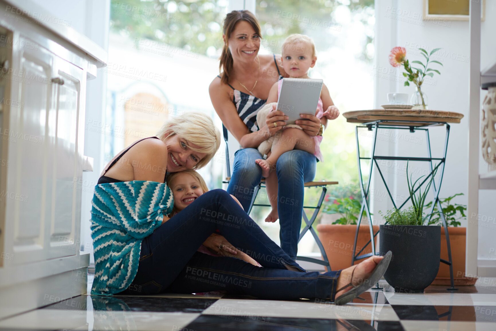 Buy stock photo Portrait, lesbian parents and love for children, adoption or happiness with family home, bonding or tablet. Female people, partner and pride in house, lounge or apartment on weekend for lgbt marriage