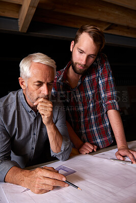 Buy stock photo Engineer, team and men with blueprint, thinking or plan for construction with serious father teaching son. Architecture, apprentice and senior mentor drawing design for problem solving in workshop