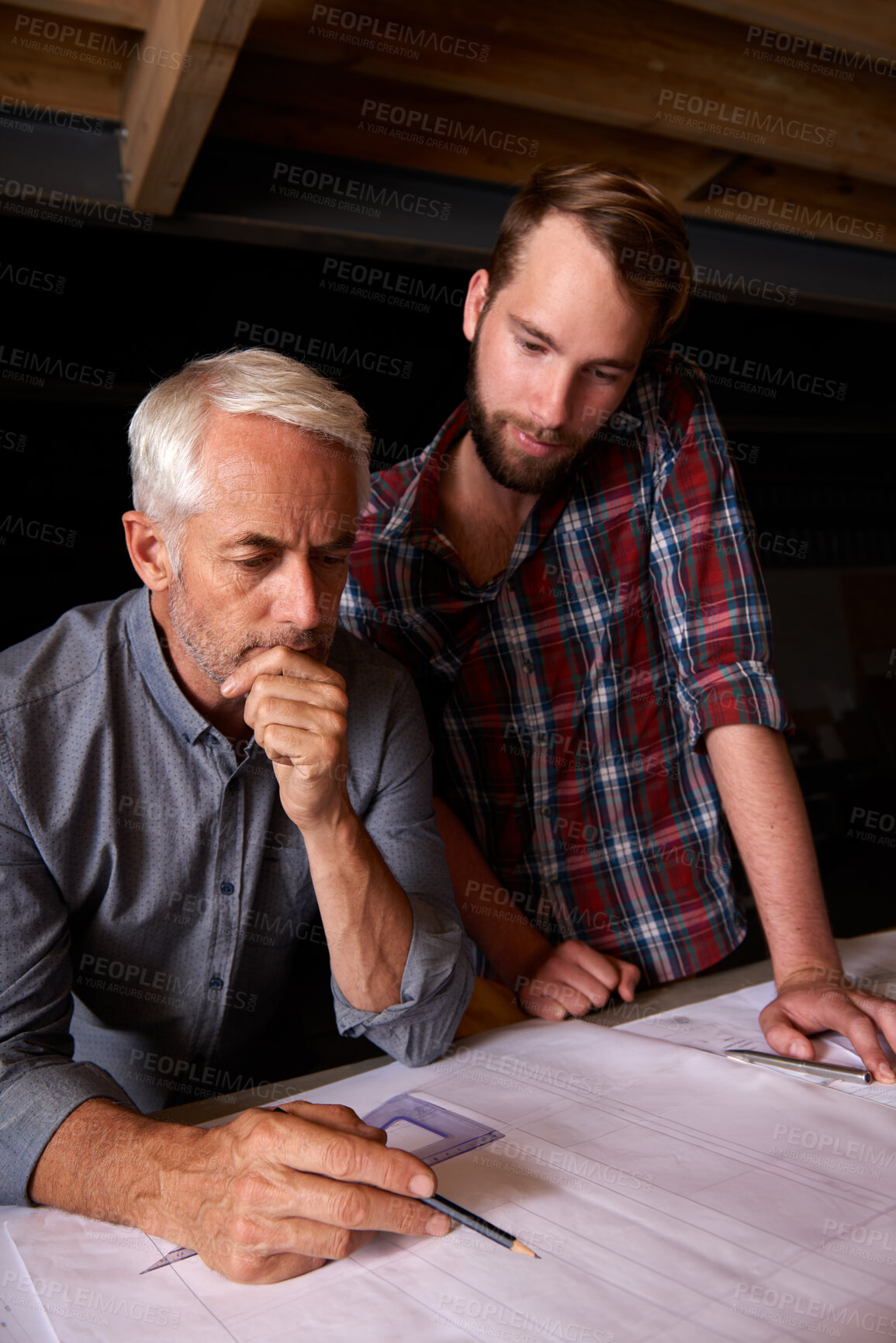 Buy stock photo Engineer, team and men with blueprint, thinking or plan for construction with serious father teaching son. Architecture, apprentice and senior mentor drawing design for problem solving in workshop