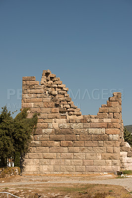 Buy stock photo Travel, history and building in Greece as temple, structure and ancient architecture at destination. Landmark, monument and city wall with tourism, culture and stone for discovery, adventure and site