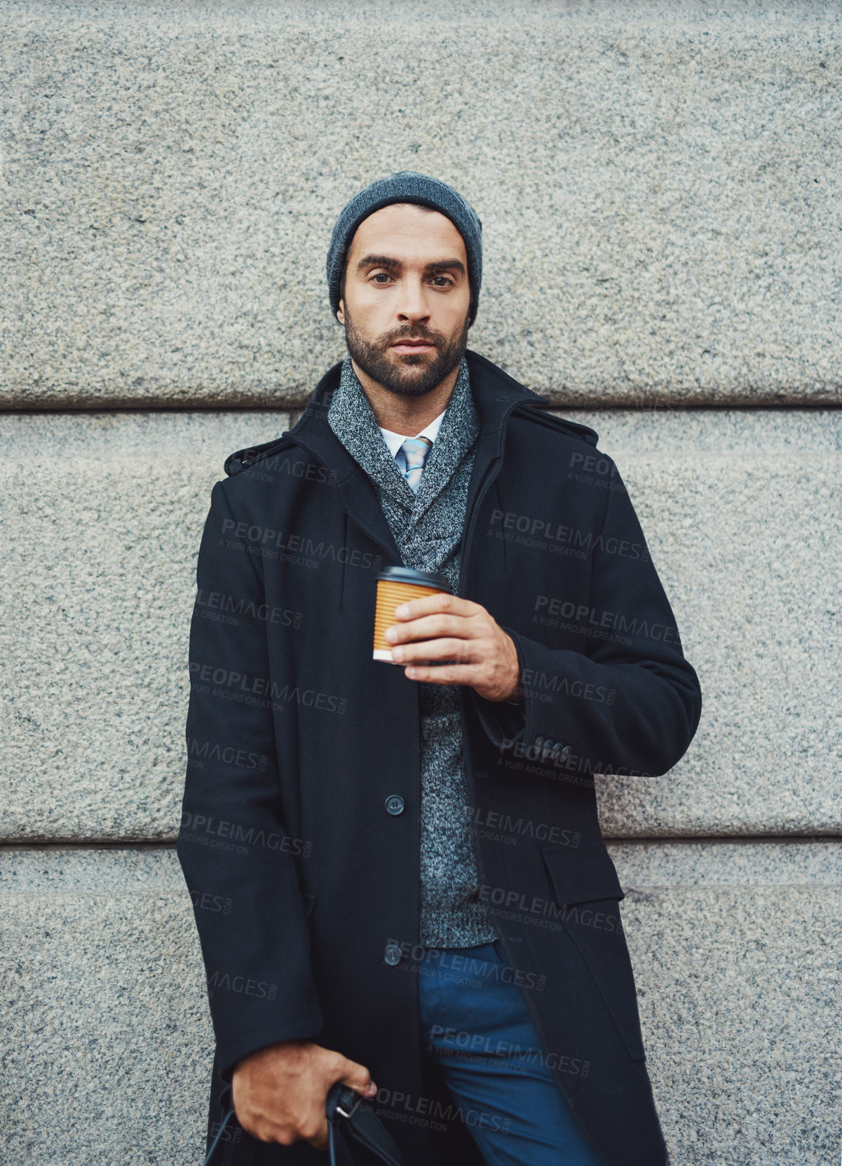 Buy stock photo Portrait, coffee and man with fashion, travel and confident against wall, serious and outdoor with bag. Commuting, drink and trendy with clothes of lawyer, winter and stylish with coat in New York