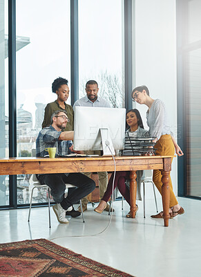 Buy stock photo Shot of businesspeople working together in the office 