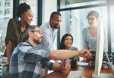 Buy stock photo Shot of businesspeople working together in the office 