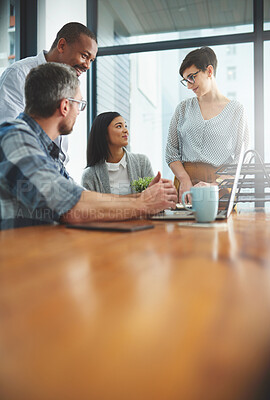 Buy stock photo Shot of businesspeople working together in the office 