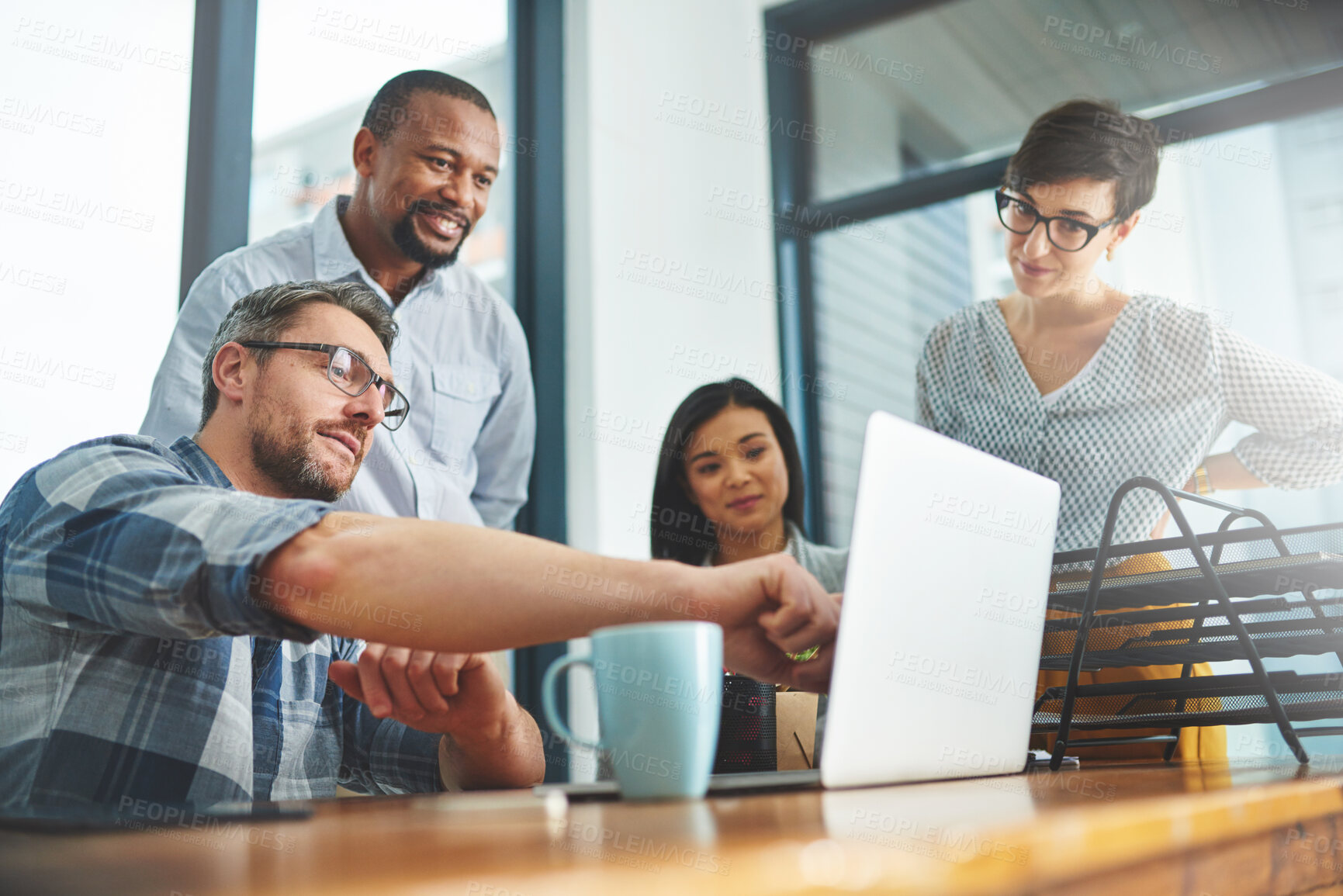 Buy stock photo Shot of businesspeople working together in the office 