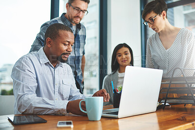 Buy stock photo Shot of businesspeople working together in the office 