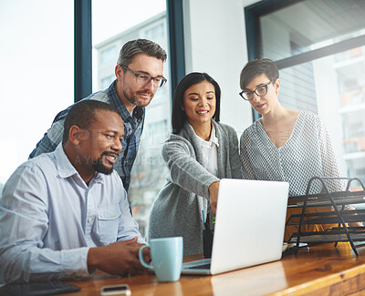 Buy stock photo Shot of businesspeople working together in the office 