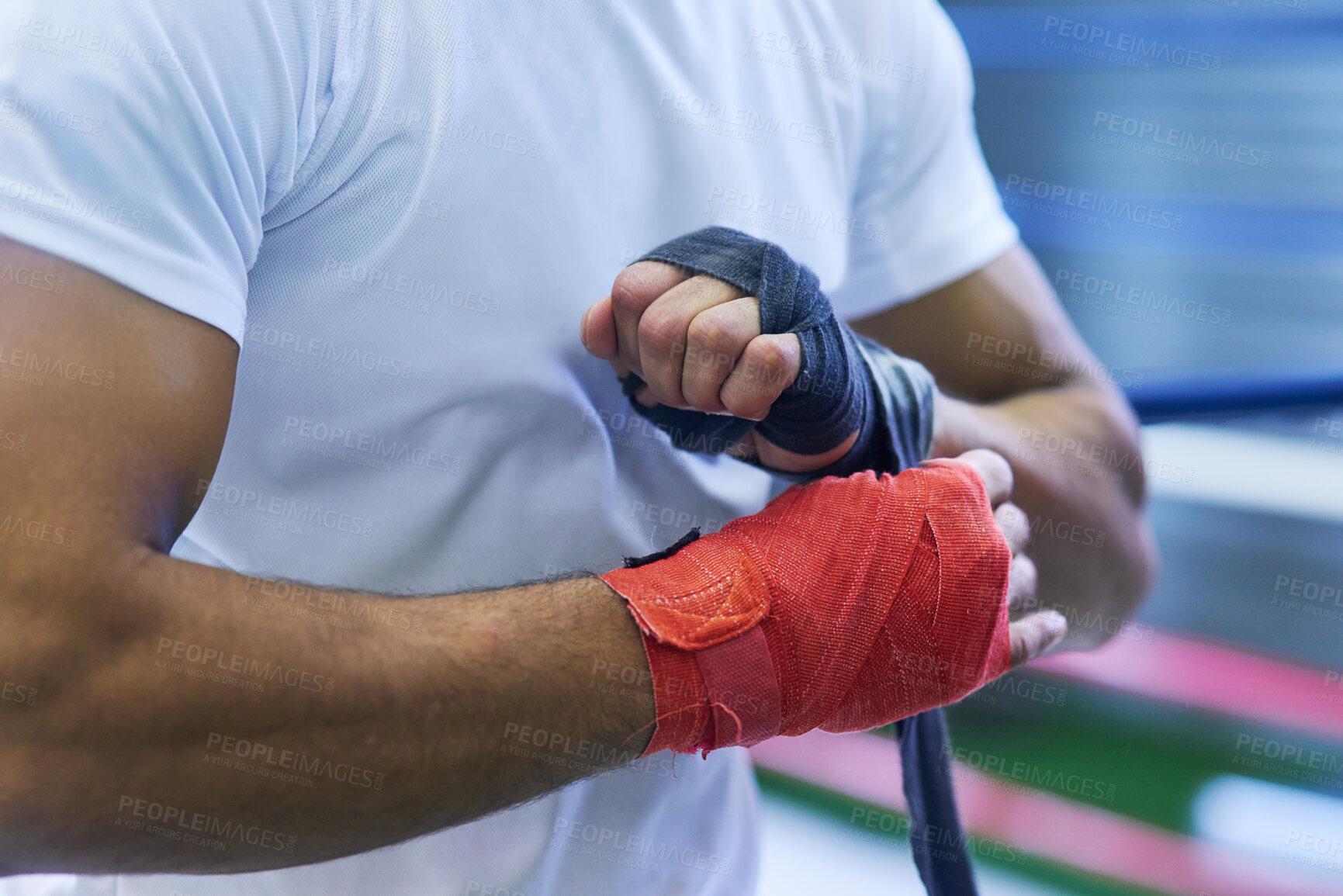 Buy stock photo Gym, fighter or man wrapping hands for training, exercising and workout for competition. Professional, boxer and male athlete in ring ready with energy, commitment and boxing with motivation