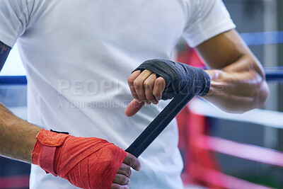 Buy stock photo Gym, boxing or man wrapping hands for workout, exercising and training for competition. Professional, boxer and male athlete in ring ready with energy, commitment and mma fighter with motivation