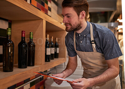 Buy stock photo Man, documents and wine on shelf in restaurant for alcohol, inventory and management for hospitality. Male cafe owner, paperwork and sale for small business, pub and entrepreneur in service industry 