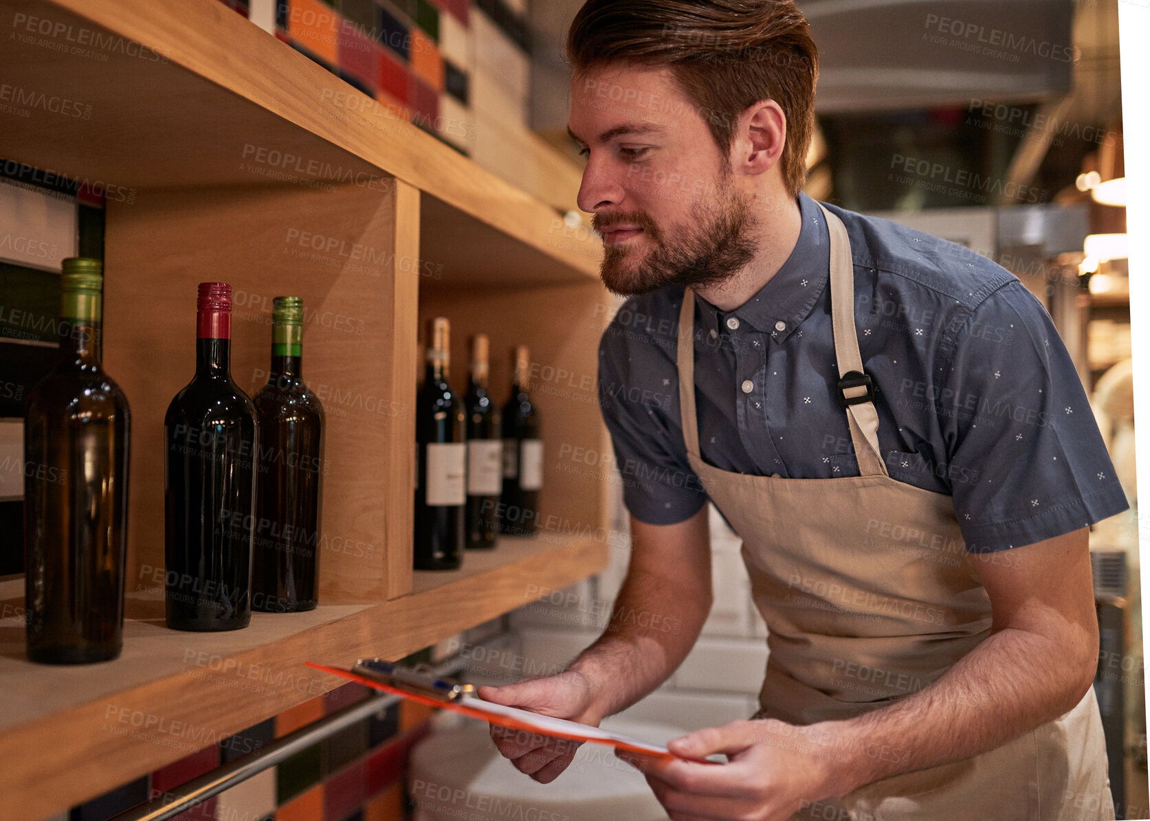 Buy stock photo Man, documents and wine on shelf in restaurant for alcohol, inventory and management for hospitality. Male cafe owner, paperwork and sale for small business, pub and entrepreneur in service industry 