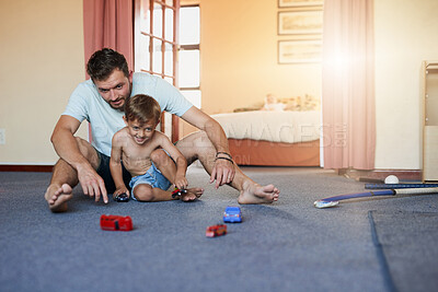 Buy stock photo Toy, car and man with child on floor for fun development, creativity and bonding together at home. Happy, father and son with game in bedroom for motor skills, cognitive and imagination on weekend