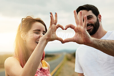 Buy stock photo Couple, heart hands and happiness for road trip, positive emotion and care with kindness in outdoor. Gesture, woman and man with excitement, love and symbol as sign for support or affection.