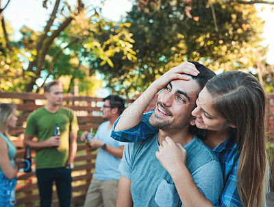 Buy stock photo Couple, hug and backyard party with friends, love and outdoor at labor day and social event. Beer, conversation and happy people with summer fun, vacation and group reunion with smile and care