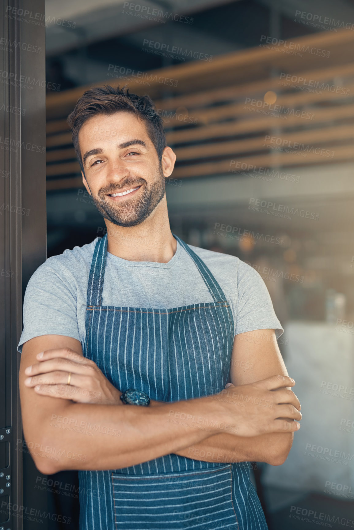 Buy stock photo Portrait, doorway and man in cafe, apron and waiter with confidence, career ambition and hospitality. Face, happy person or small business with service industry, professional and server in restaurant