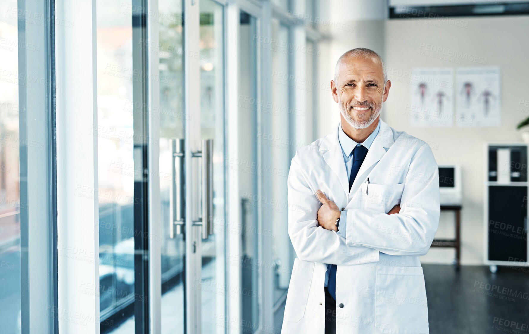 Buy stock photo Portrait of a mature doctor standing in a hospital