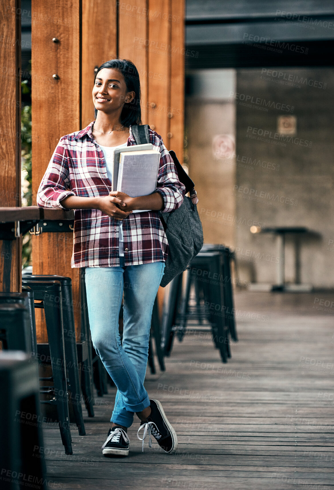 Buy stock photo Indian girl, student and portrait at college with books for learning, studying and education on campus. Person, happy and backpack with novel for exam information, university scholarship or knowledge