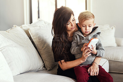 Buy stock photo Mother, sofa and kids toy in family home with tablet, care and support together with game in living room. Love, weekend and fun with motherhood and boy playing on youth development and learning app