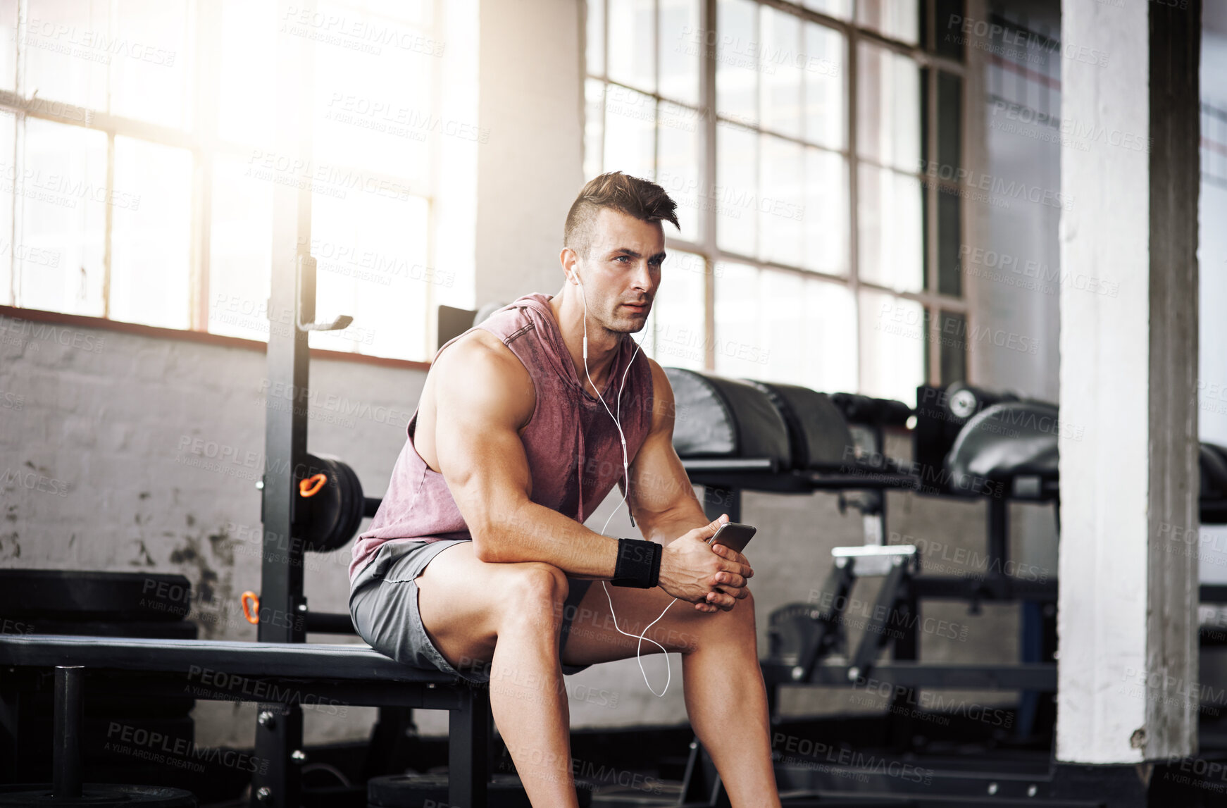 Buy stock photo Man, thinking and music in gym for fitness, exercise and wellness with radio for motivation. Training, mobile and male bodybuilder on break from cardio, workout and earphones for listening to podcast