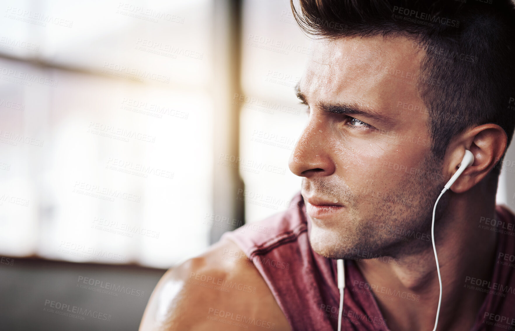 Buy stock photo Man, tired and music in gym for training, workout and wellness with radio for motivation. Exercise, thinking and male bodybuilder on break from cardio, fitness and earphones for listening to podcast