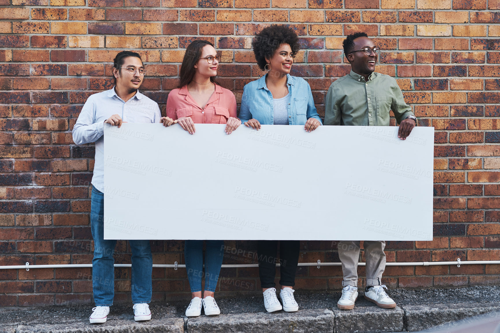 Buy stock photo Advertising, diversity and poster mockup of people outdoor on city street with brick wall background. Business, marketing or space on banner with man and woman employee group together in urban town