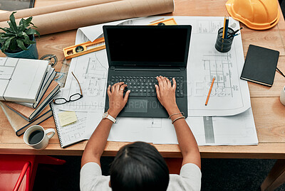 Buy stock photo Woman, architect and typing on laptop with paperwork, above or development with design in office. Person, keyboard and blank computer screen with mockup space for review, engineering and blueprint