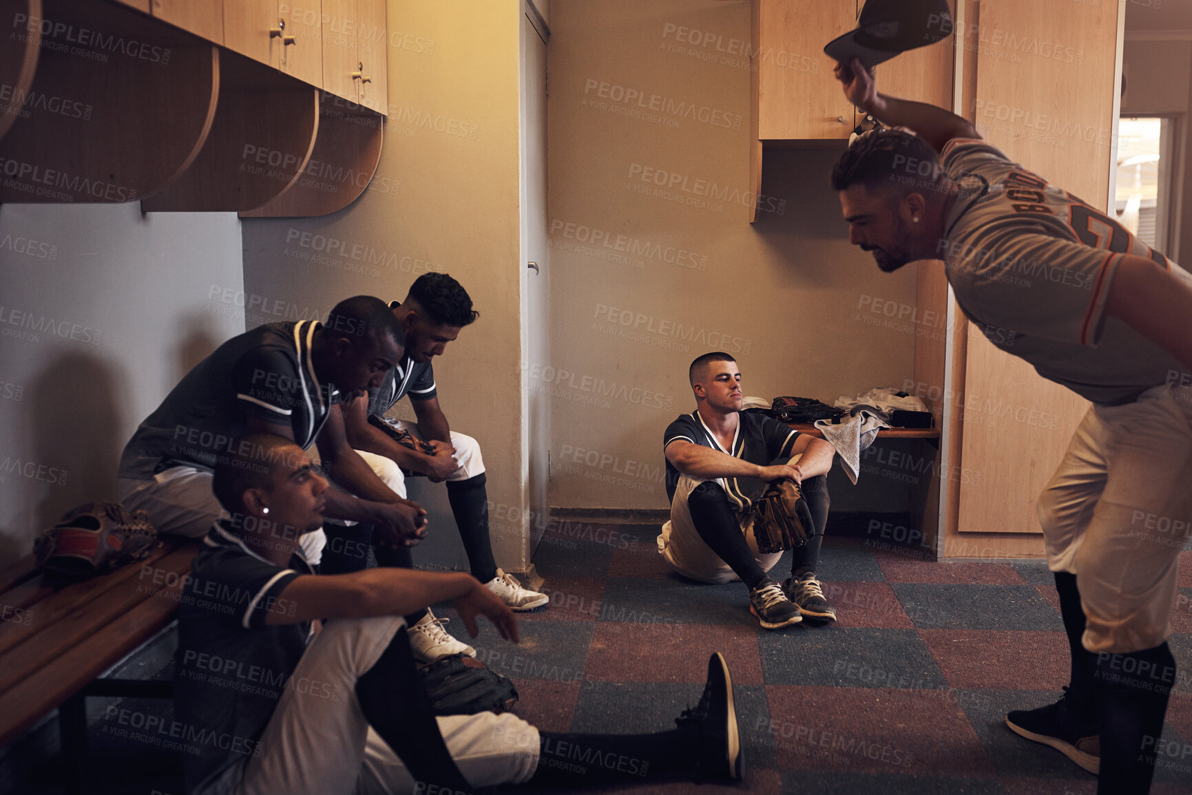 Buy stock photo Group, baseball and angry in locker room for game discussion or reflection, fail performance or sad for result. Men, sport and building with communication for training exercise or practice workout