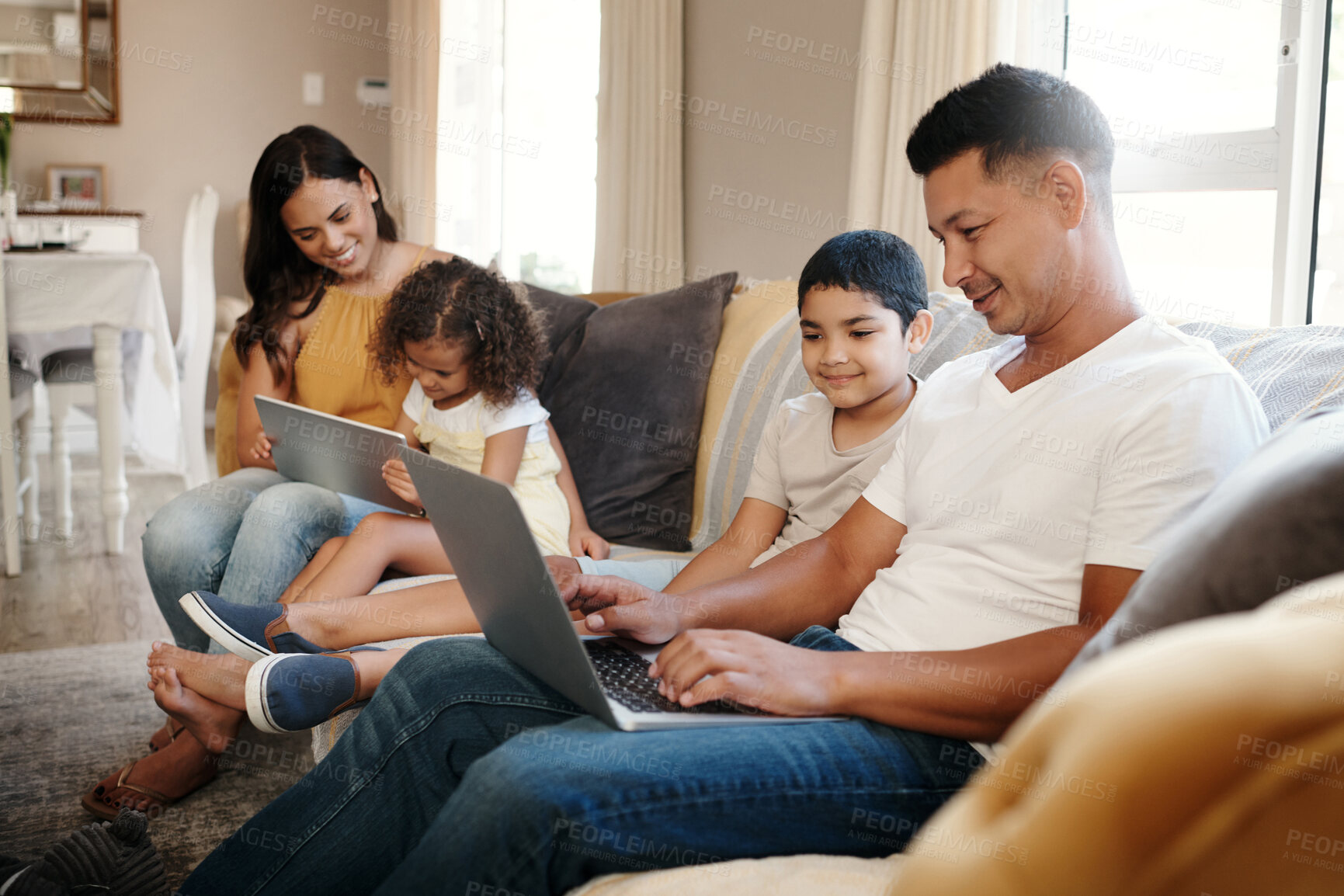 Buy stock photo Tablet, laptop and parents with children on sofa for streaming animation film, communication and online games in home. Mom, dad and kids with tech for social media, bonding time and educational video