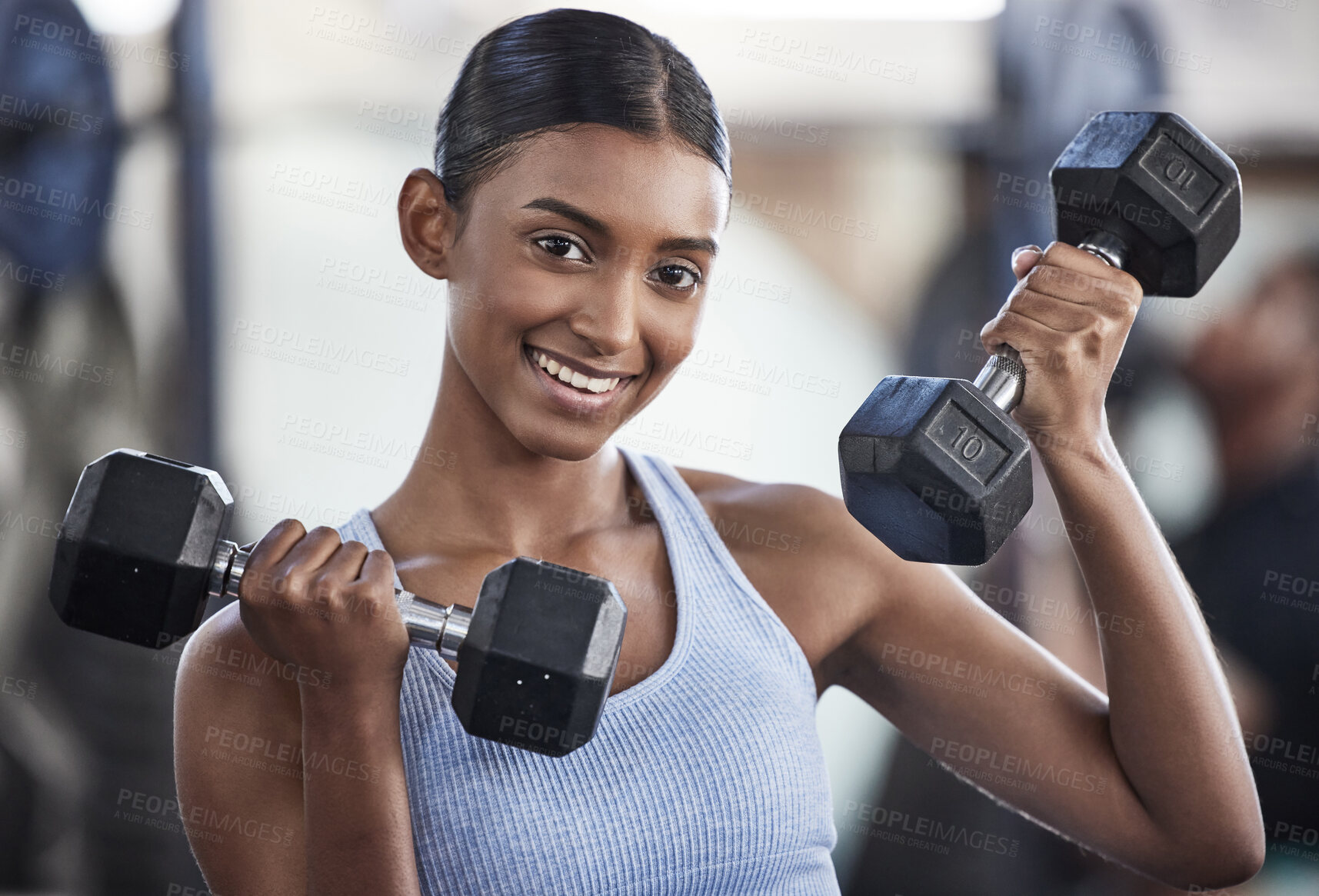 Buy stock photo Portrait of woman in gym, dumbbell and smile for weightlifting, power and muscle at sports club. Balance, fitness and female bodybuilder holding weights and training with health goals and happiness.