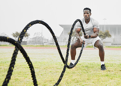 Buy stock photo Outdoor, rope and black man with fitness, training and endurance with wellness, strong and challenge. African person, athlete and guy with energy, workout and exercise with power, sports and healthy