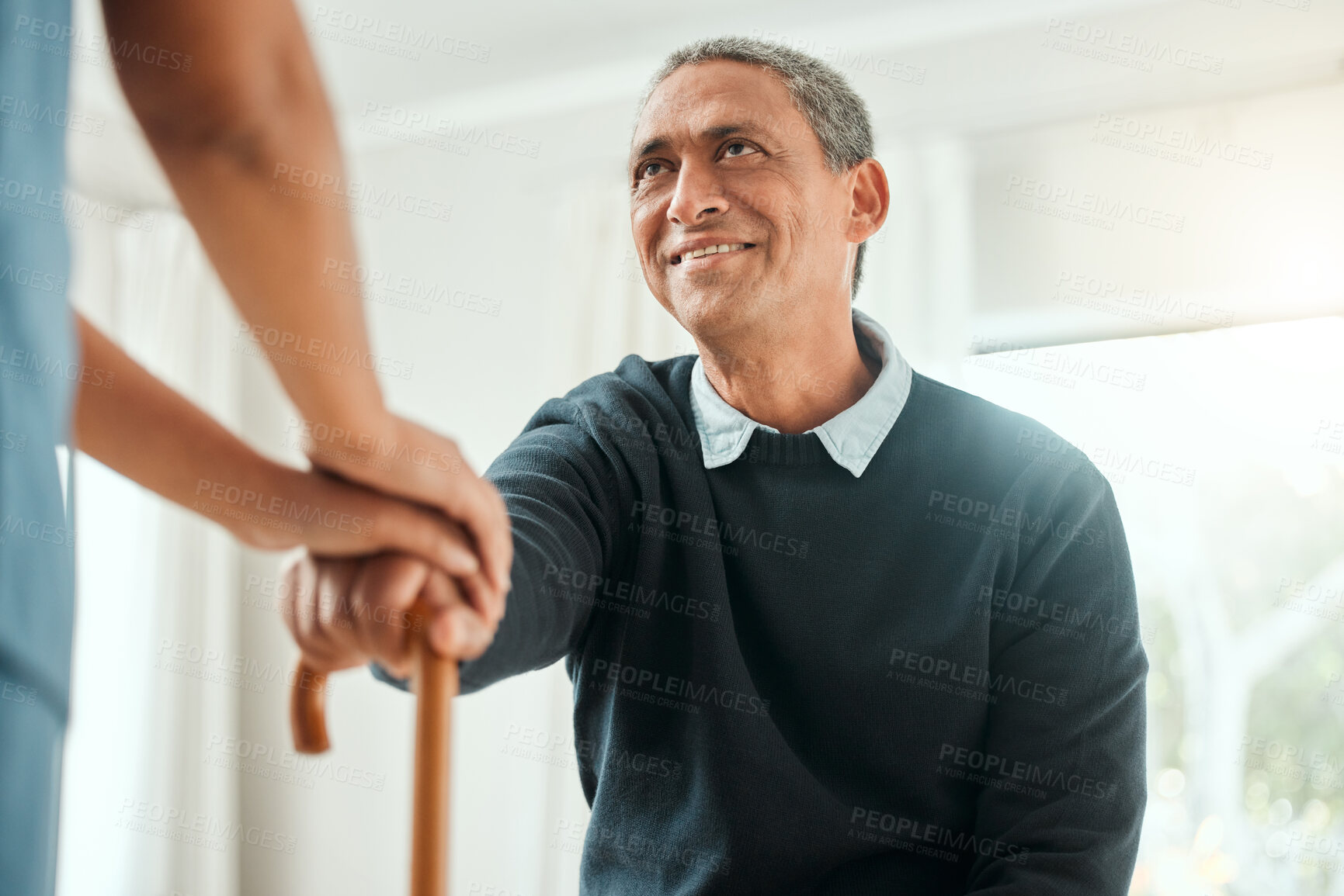 Buy stock photo Holding hands, nurse and man with walking stick for support at assisted living facility for medical checkup. Happy, caregiver and senior male person with disability for comfort, empathy or care.