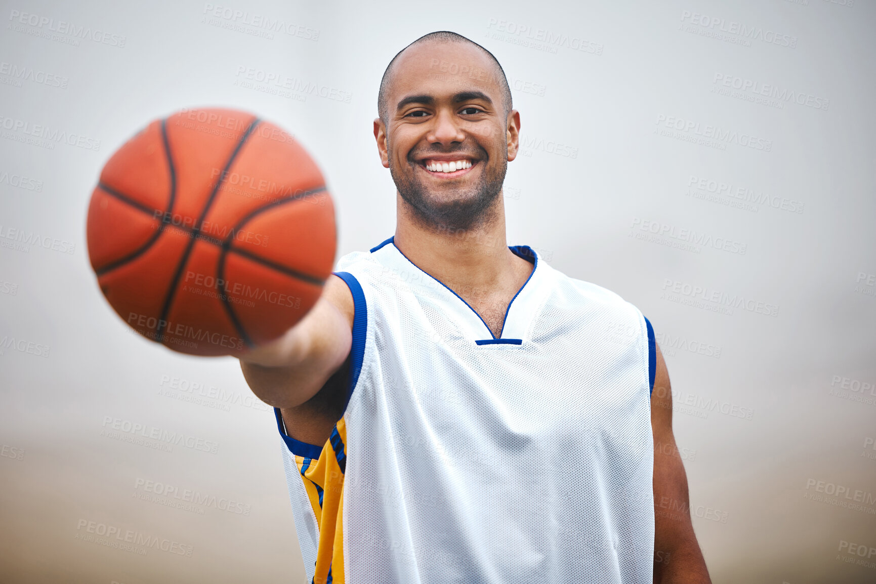 Buy stock photo Happy man, portrait and basketball player with ball for game, match or outdoor fitness on pitch or field. Active, young male person or athlete with smile for sport, exercise or workout in nature