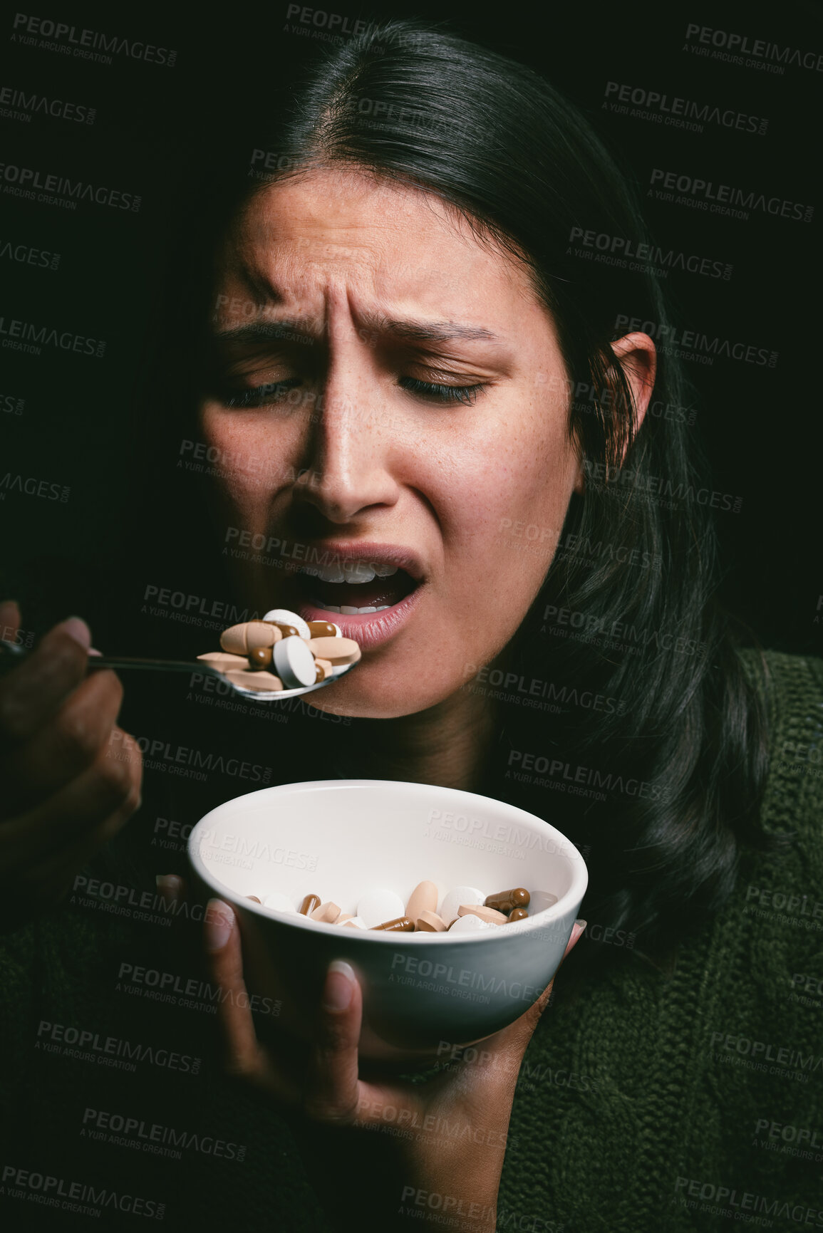 Buy stock photo Woman, stress and pills for health in studio, medicine and drugs treatment for bulimia on black background. Female person, anxiety and bowl of tablets for appetite, overdose and capsule for psyche