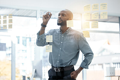 Buy stock photo Planning, writing and business man on glass board for brainstorming, schedule and scrum and agile solution. Thinking, ideas and focus of African person on window sticky notes, job priority or project